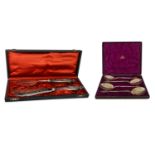 A CASED PAIR OF VICTORIAN SILVER PLATED FISH KNIFE & FORK SERVERS, together with a cased pair of