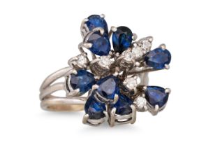 A SAPPHIRE AND DIAMOND CLUSTER RING, of abstract form, mounted in 9ct white gold, size H - I