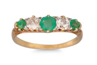 A DIAMOND AND EMERALD FIVE STONE RING, mounted in 18ct gold, carved shank, size N - O *** (chip to