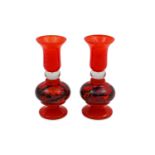 A MATCHED PAIR OF CONTEMPORARY CONTINENTAL HAND BLOWN GLASS CANDLE HOLDERS, in burnt orange, with