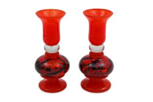 A MATCHED PAIR OF CONTEMPORARY CONTINENTAL HAND BLOWN GLASS CANDLE HOLDERS, in burnt orange, with