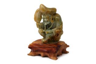A CHINESE CARVED JADE FIGURE, of a crouching 'TAU' from the legends of JI Gong, the living Buddha,