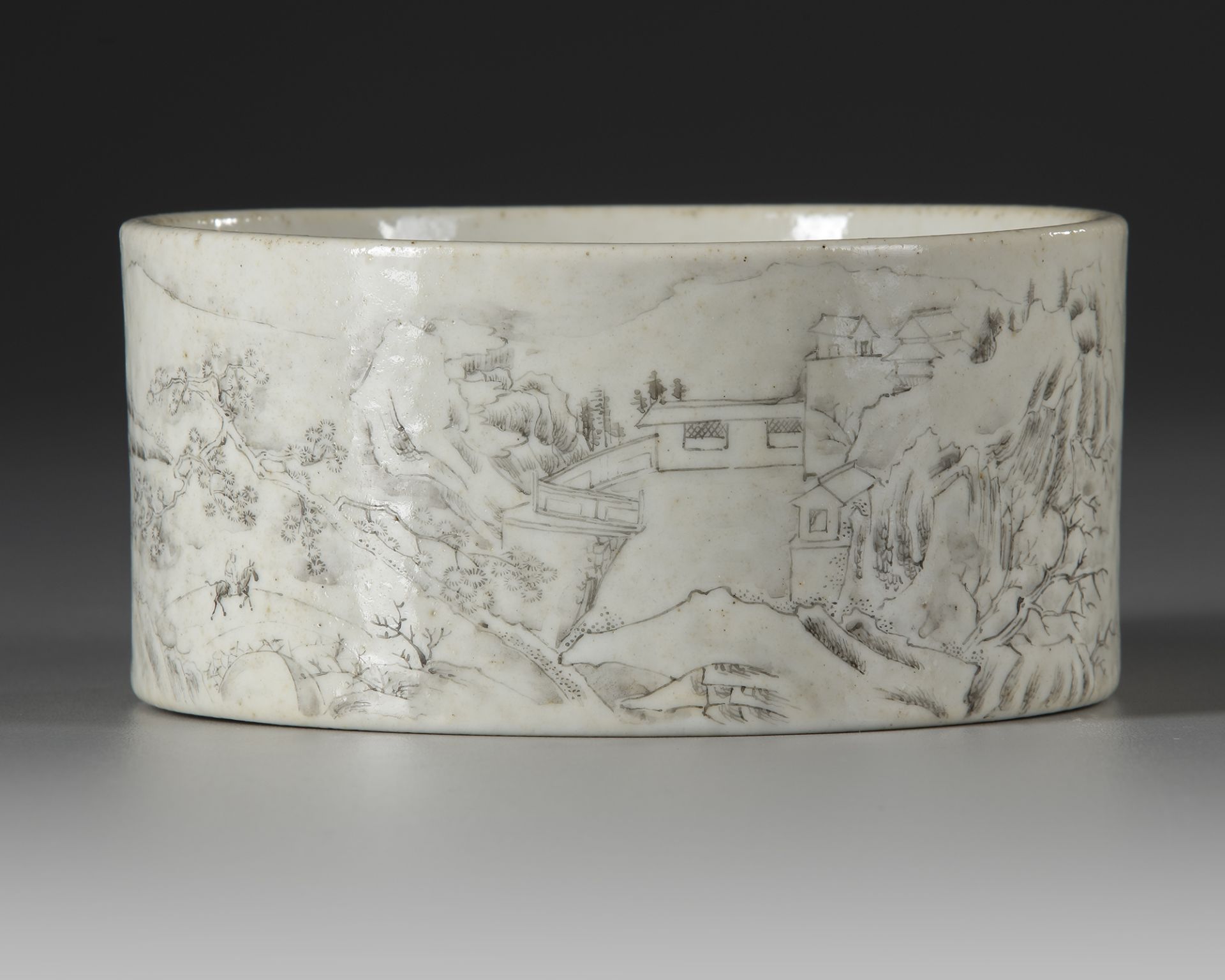 A CHINESE GRISAILLE LANDSCAPE BRUSH POT, REPUBLIC PERIOD, 20TH CENTURY
