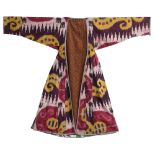 A PURPLE GROUND IKAT ROBE, UZBEKISTAN, 19TH CENTURY