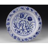 A SAFAVID BLUE AND WHITE POTTERY DISH, PERSIA, 16TH CENTURY