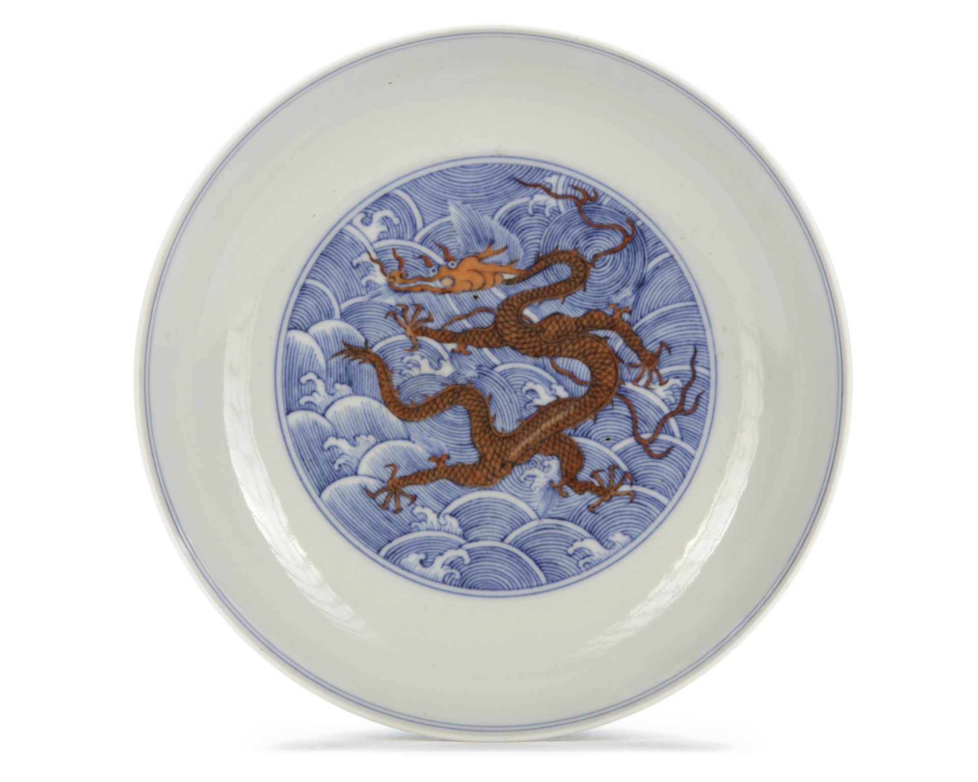A CHINESE IRON-RED-DECORATED BLUE AND WHITE DRAGON DISH, 19TH CENTURY