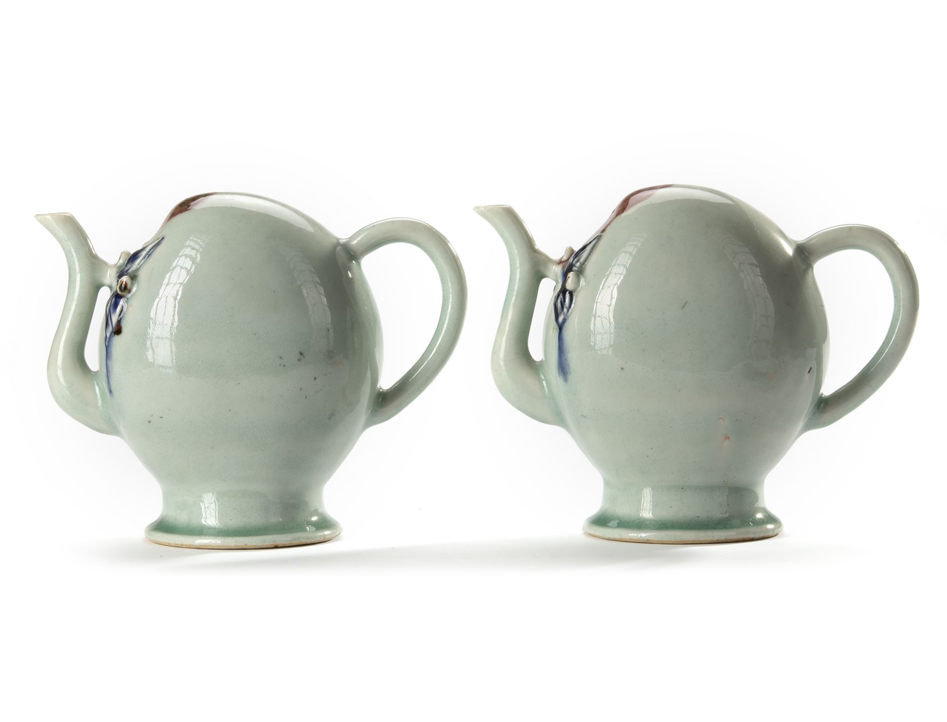 A PAIR OF CELADON-GLAZED ‘CADOGAN’ WINE POTS, QING DYNASTY (1644-1912)