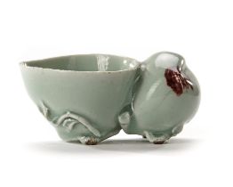 A CHINESE CELADON WATER DROPPER IN THE SHAPE OF A PEACH, KANGXI PERIOD (1662-1722)