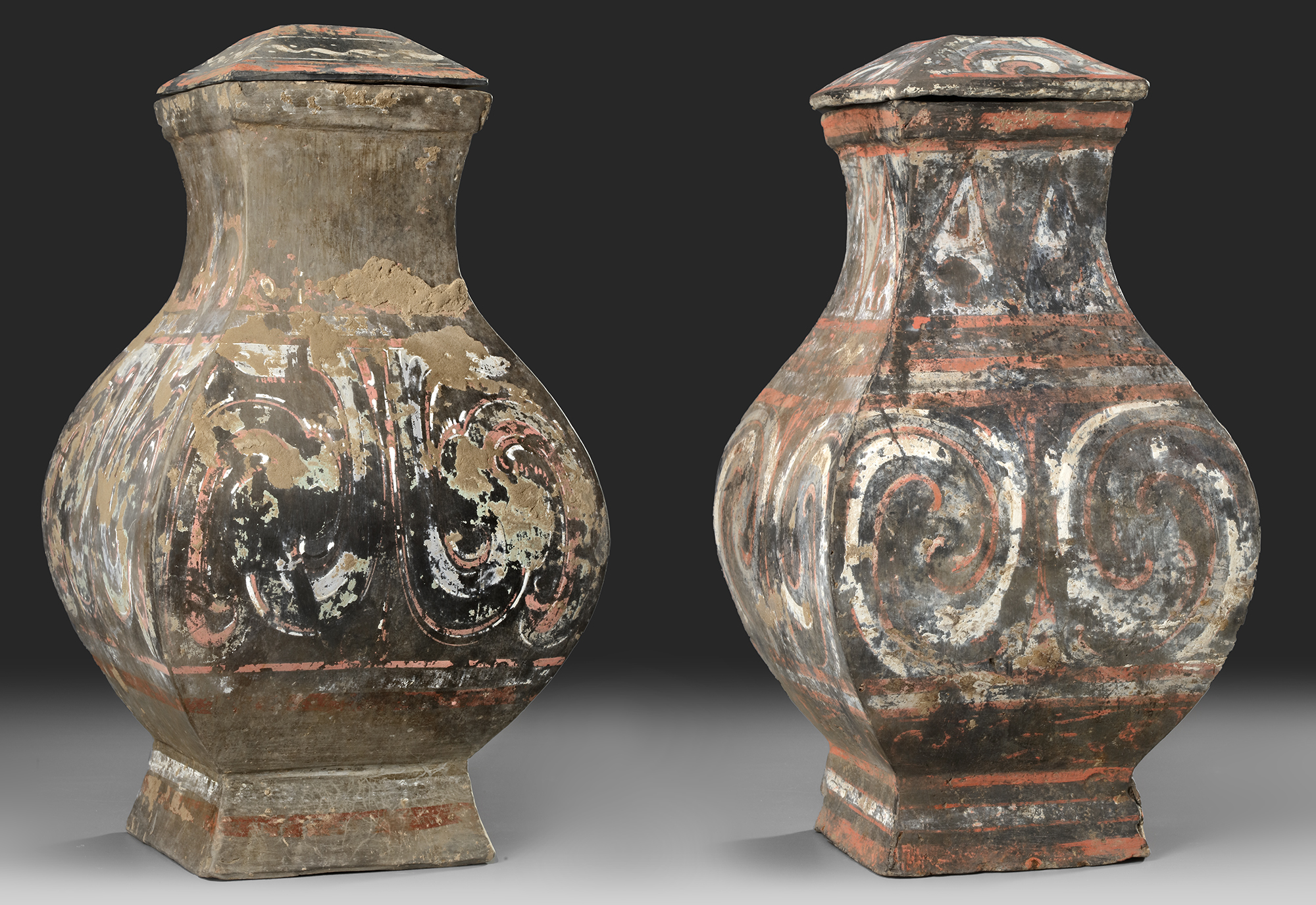 A PAIR OF CHINESE POTTERY 'FANG HU' VASES, HAN DYNASTY (206 BC-220 AD)