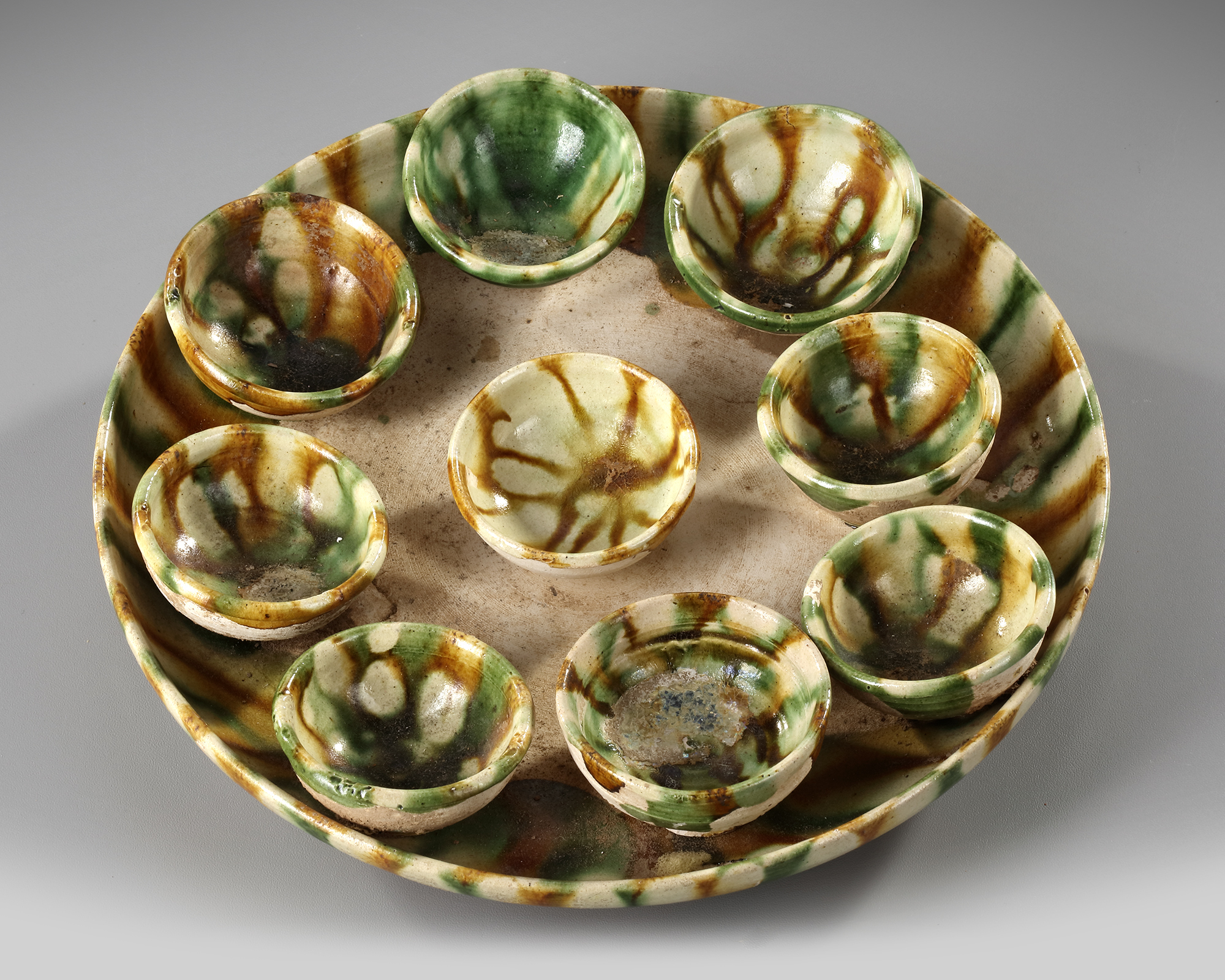 A CHINESE SANCAI GLAZED TRAY AND NINE CUPS, TANG DYNASTY (618-906 AD) - Image 2 of 4
