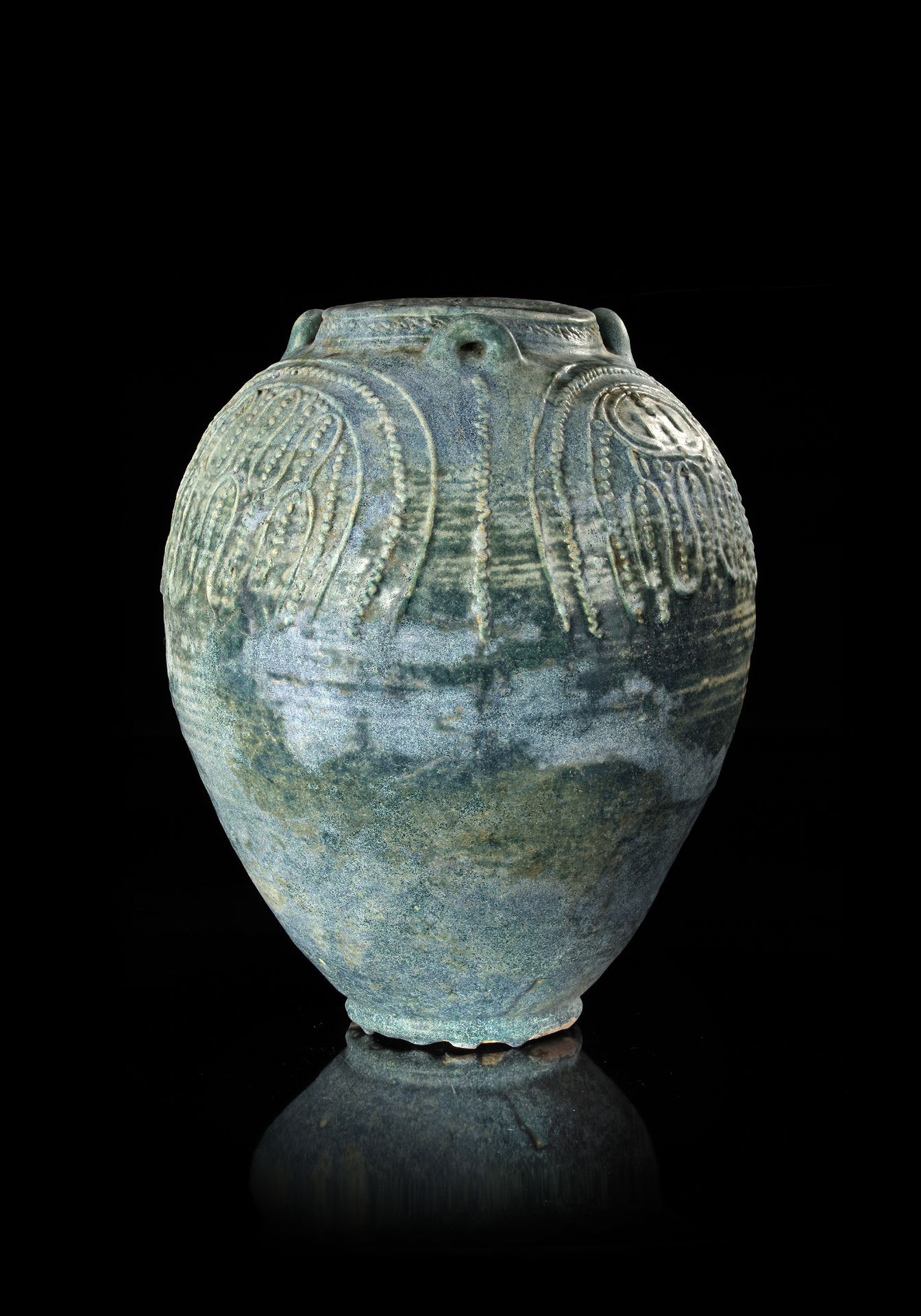 A LARGE UMAYYAD TURQUOISE-GREEN GLAZED JAR, MESOPOTAMIA, 7TH-8TH CENTURY