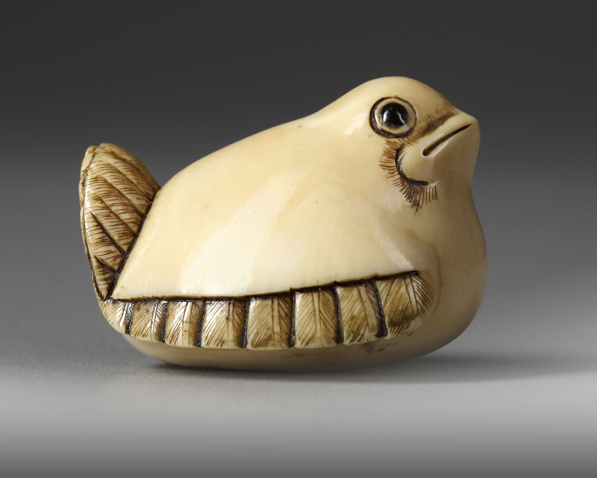 A JAPANESE IVORY NETSUKE OF THE SHAPE OF A SPARROW, SECOND HALF 19TH CENTURY