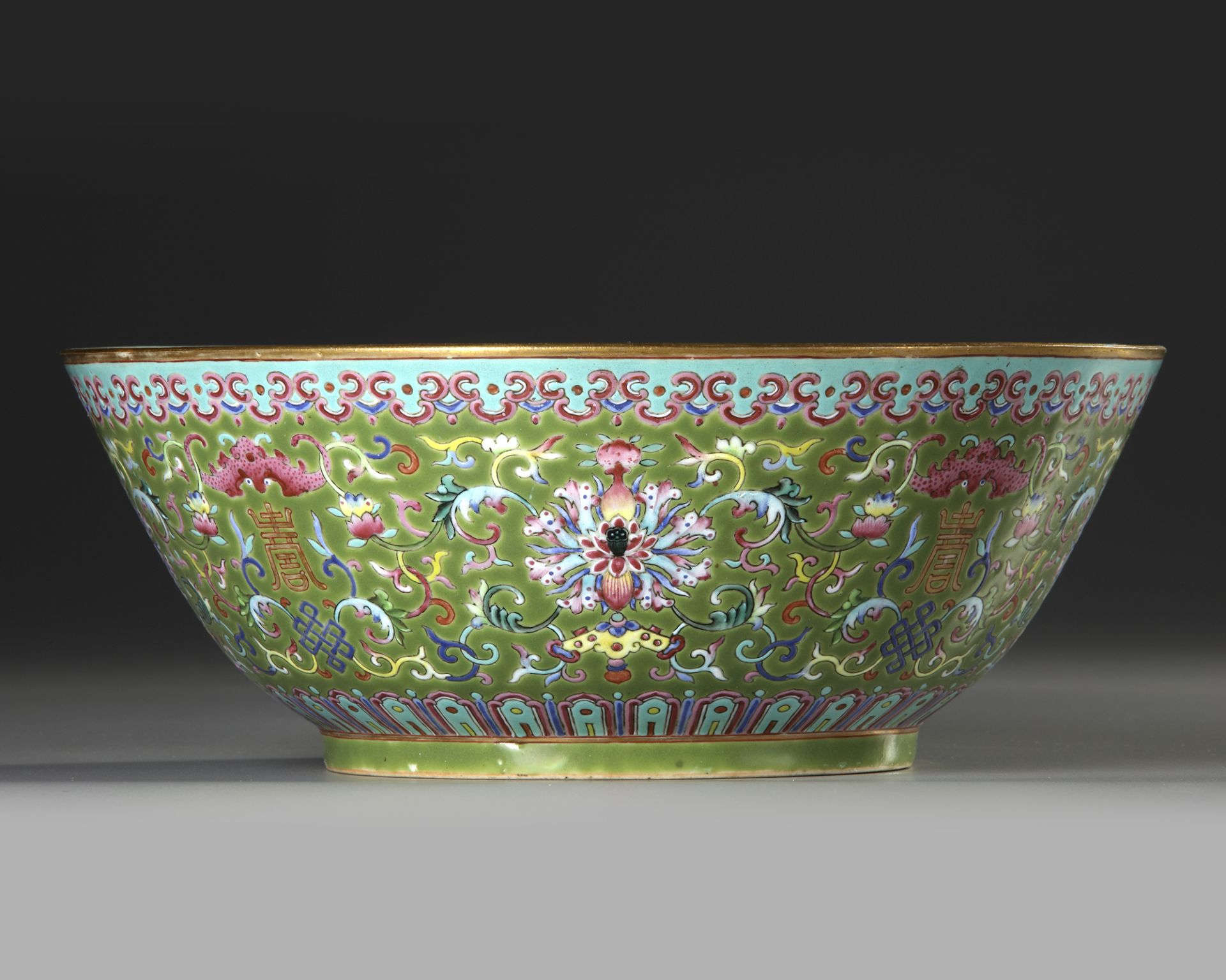 A LARGE FAMILLE ROSE GREEN-GROUND BOWL, DAOGUANG SIX-CHARACTER SEAL MARKS IN IRON RED AND OF THE PE