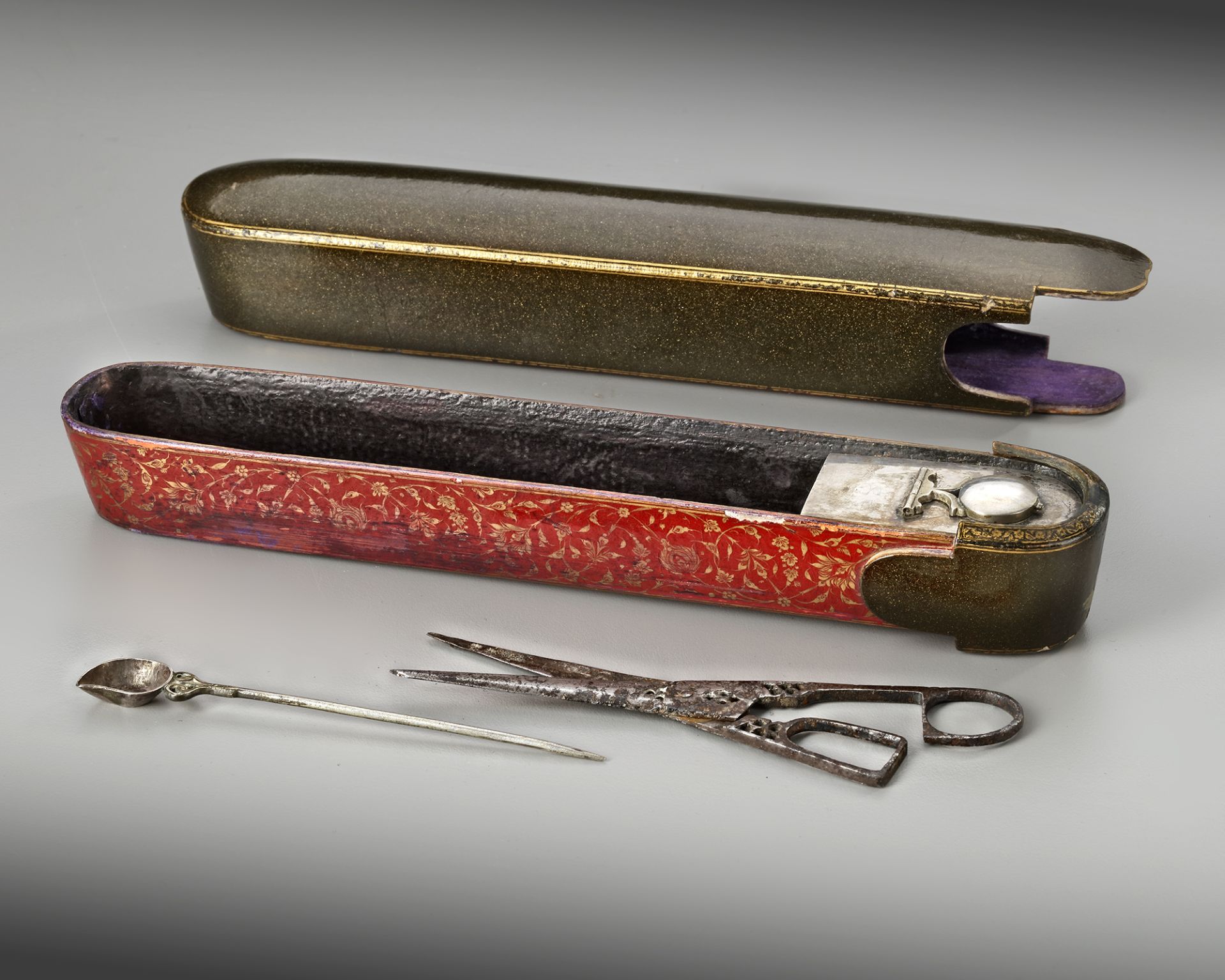 A QAJAR LACQUER PAPIER MACHE PEN-BOX (QALAMDAN ) WITH SILVER SCISSORS AND SCOOP, PERSIA, 19TH CENTUR