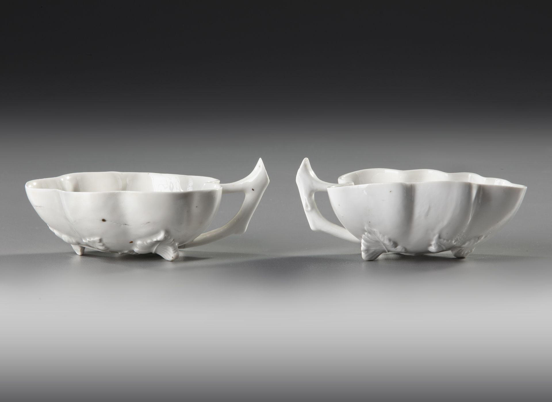 TWO CHINESE 'BLANC DE CHINE' LEAF-SHAPED CUPS, 17TH-18TH CENTURY