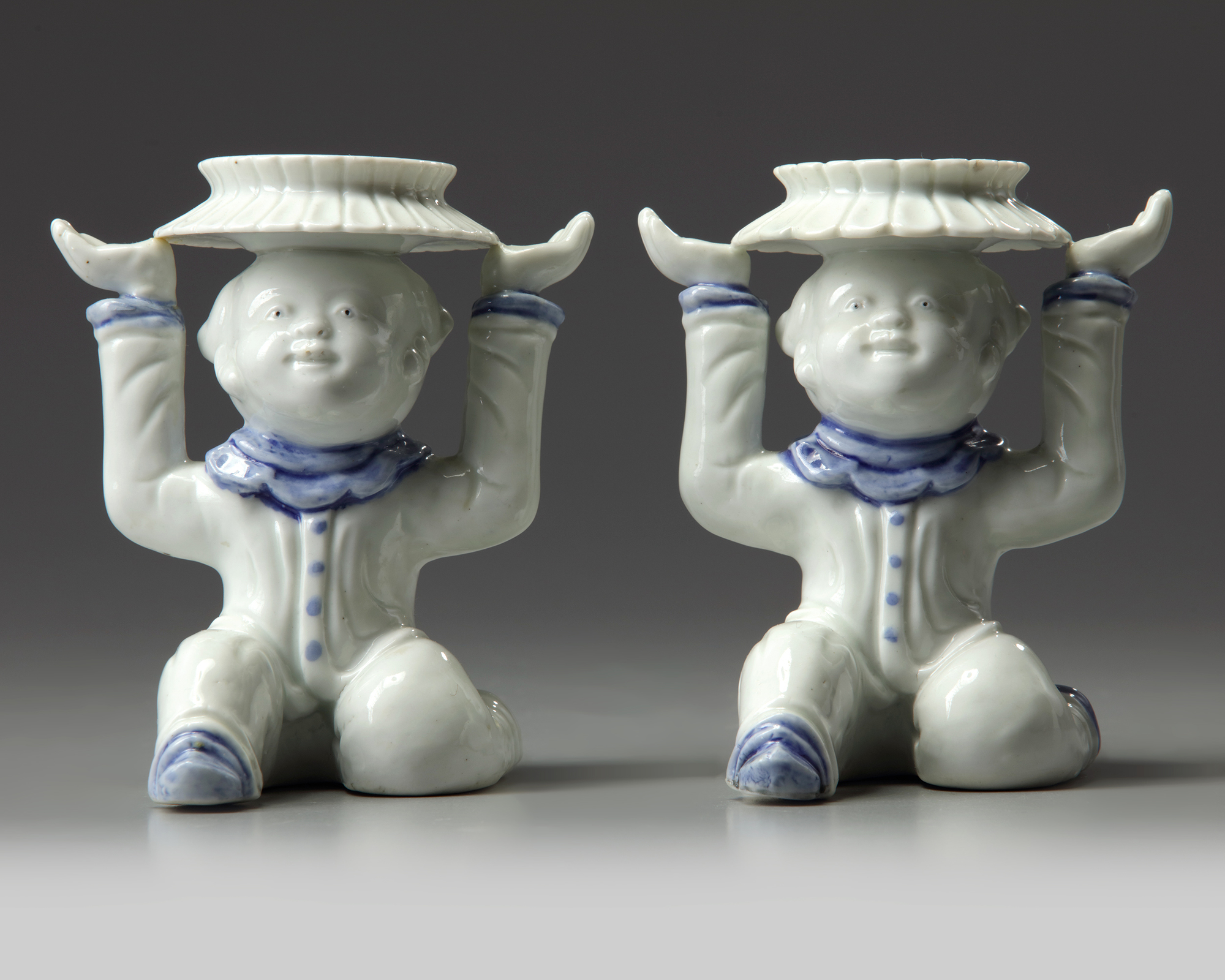 A JAPANESE PAIR OF 'BOY FIGURES', HIRADO WARE, 19TH CENTURY