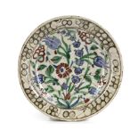 AN IZNIK 'STORM IN A TEACUP' DESIGN POTTERY DISH, TURKEY, 16TH CENTURY