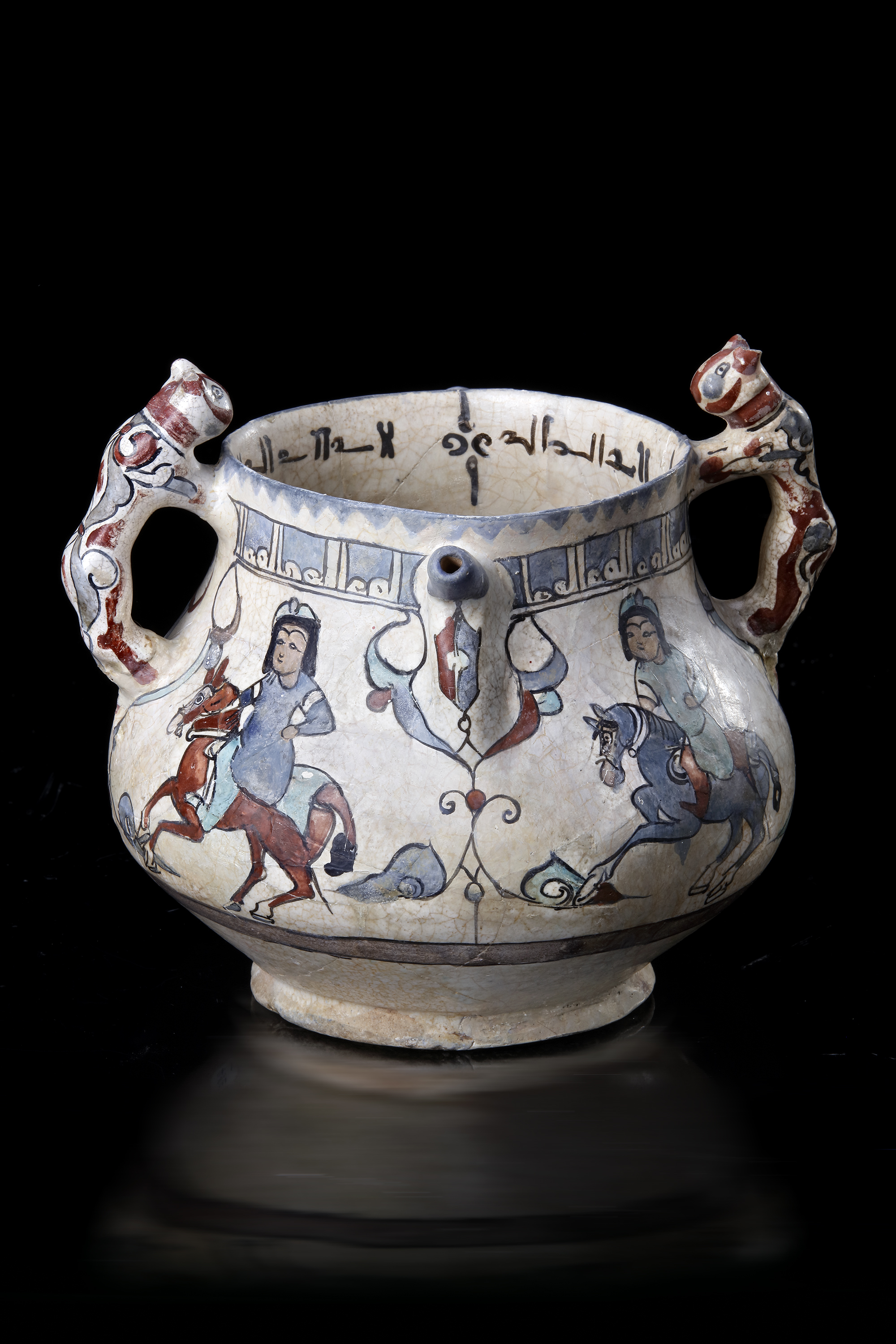 AN ISLAMIC VASE WITH ZOOMORPHIC HANDLES, PERSIA, KASHAN, LATE 12TH-EARLY 13TH CENTURY