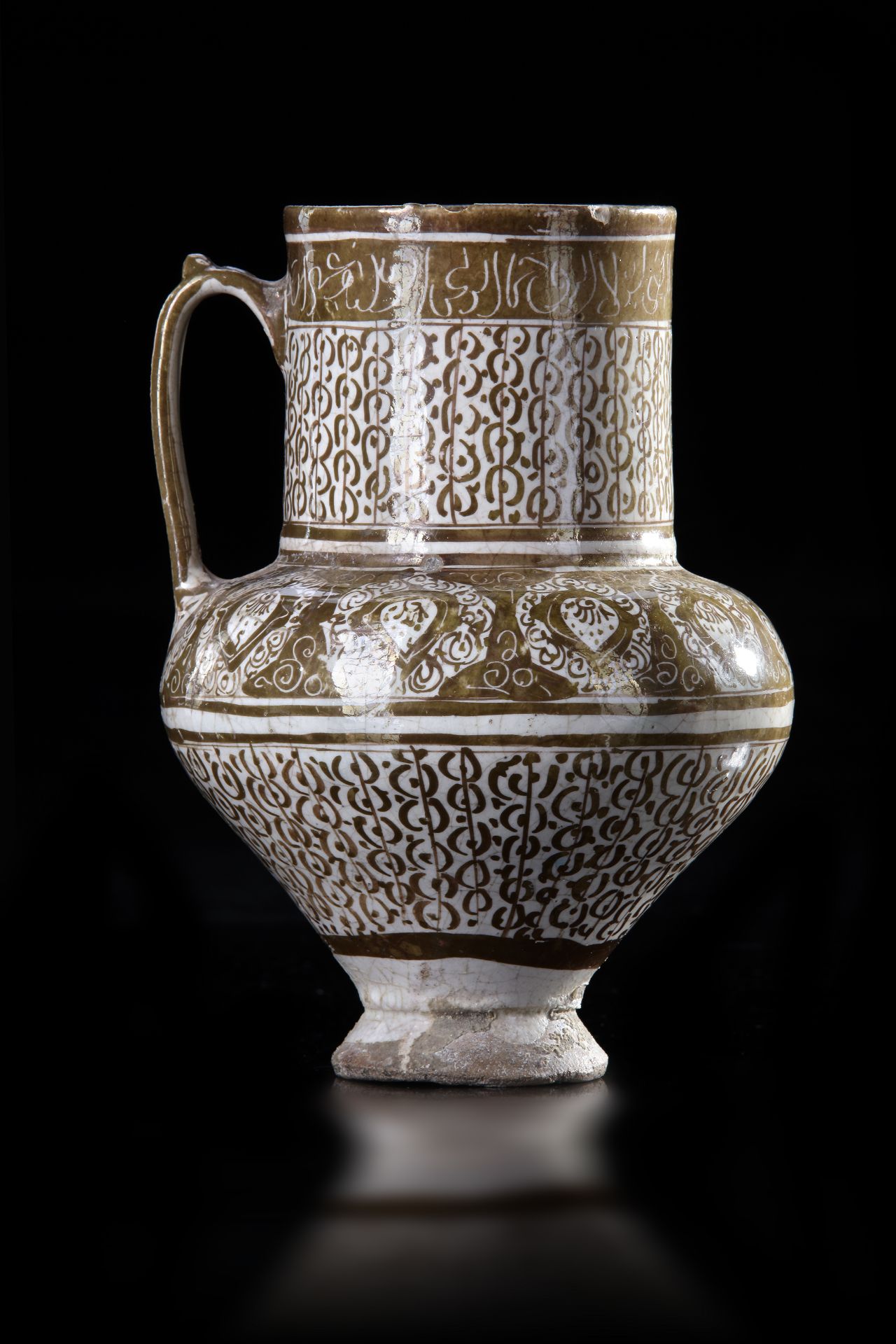 A KASHAN LUSTRE POTTERY JUG, PERSIA, 13TH CENTURY