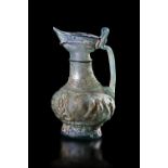 A PERSIAN MOULDED GLASS EWER, PERSIA OR CENTRAL ASIA, 10TH-12TH CENTURY