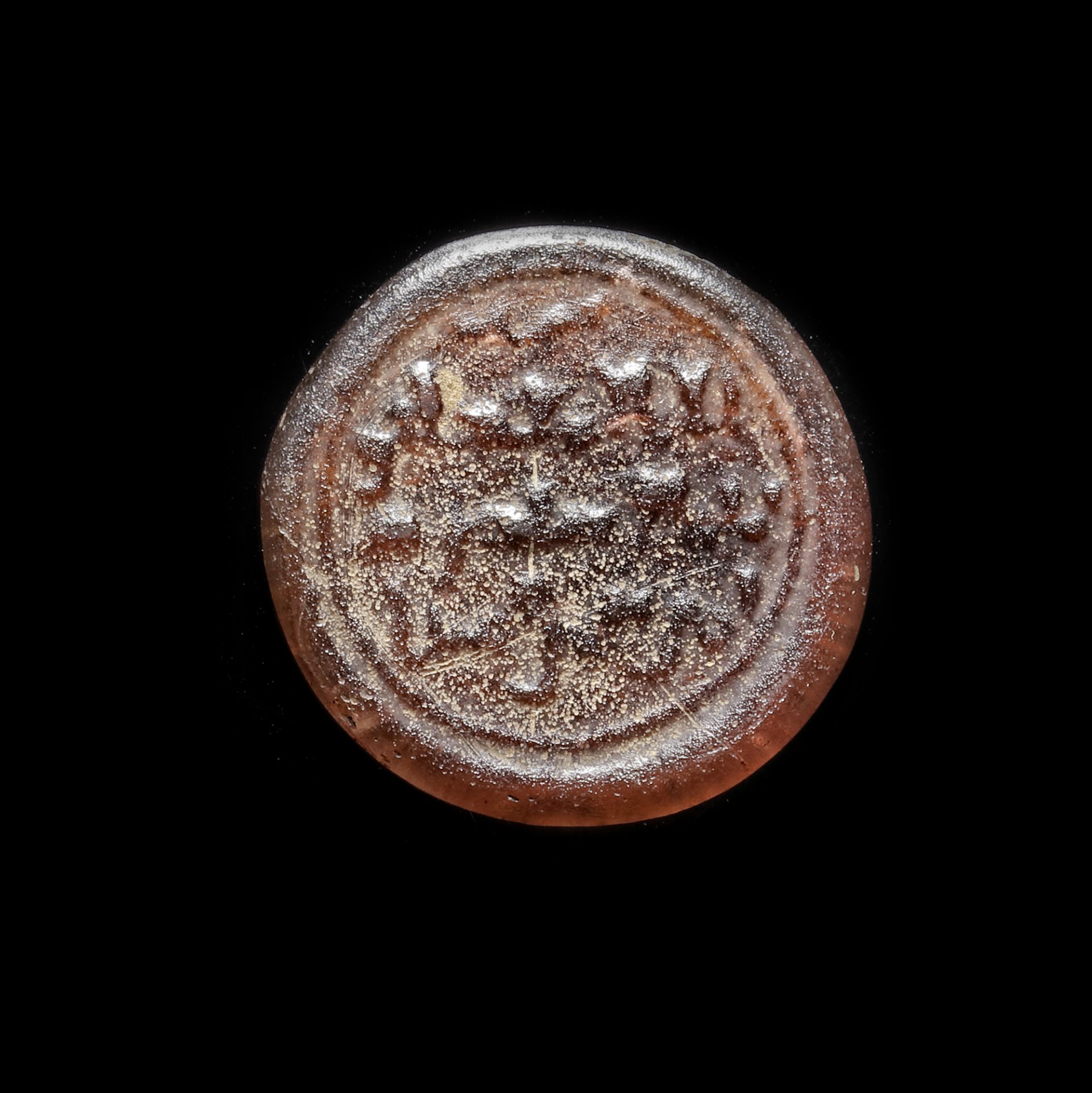 A FATIMID GLASS WEIGHT OF DINAR, EGYPT AL-MUSTANSIR BI-ALLAH (AH 427-487 / 1036-1094 AD)