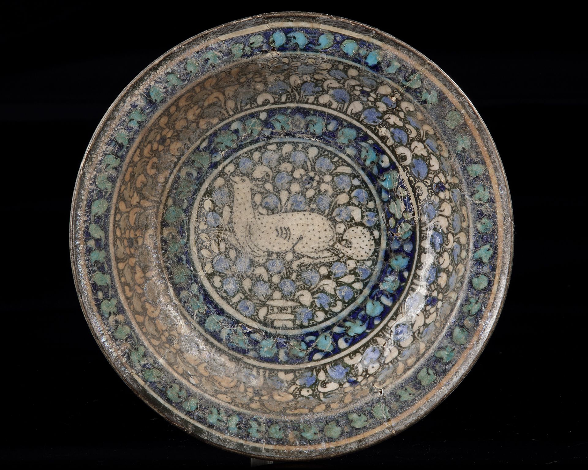 A SULTANABAD POTTERY DISH, NORTH PERSIA, LATE 13TH-EARLY 14TH CENTURY