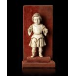 AN INDO-PORTOGUESE IVORY CARVING OF INFANT JESUS AS KRISHNA, GOA, 17TH-18TH CENTURY