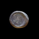 A FATIMID GLASS WEIGHT OF DOUBLE DIRHAM, AL-HAKIM BI-AMR ALLAH (386AH-411AH/ 996AD-1021AD)