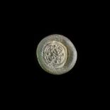 A FATIMID GLASS WEIGHT OF HALF DIRHAM, EGYPT AL-ZAHIR ( 412-427 AH/ 1021-1036 AD)