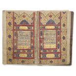 A FINELY ILLUMINATED QAJAR QURAN SIGNED BY ABDULLAH IBN ASHUR AL-ISFAHANI IN 1204 AH/1789 AD