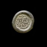 A FATIMID GLASS WEIGHT OF DIRHAM, EGYPT AL-HAKIM BI-AMR ALLAH (386AH-411AH/ 996AD-1021AD)