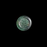 A FATIMID GLASS WEIGHT OF HALF DINAR, EGYPT AL-HAKIM BI-AMR ALLAH (386AH-411AH/ 996AD-1021AD)