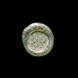 A FATIMID GLASS WEIGHT OF QUARTER DINAR, EGYPT AL-HAKIM BI-AMR ALLAH (386AH-411AH/ 996AD-1021AD)