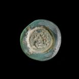 A FATIMID GLASS WEIGHT OF DINAR, EGYPT AL-AZIZ BILLAH ( 364-386AH/ 975-996 AD)