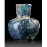 A MOULDED BLUE GLASS BOTTLE, NISHAPUR, NORTH-EAST IRAN, 9TH CENTURY