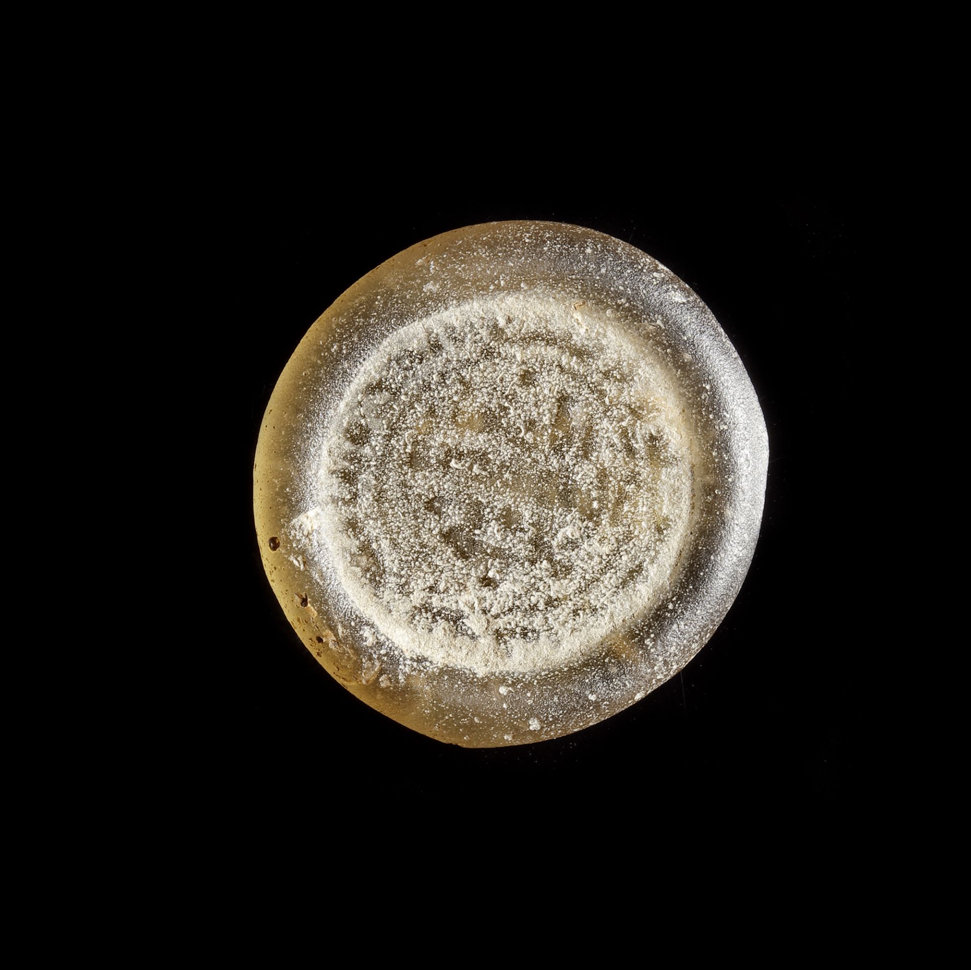 A FATIMID GLASS WEIGHT OF DOUBLE DIRHAM, EGYPT AL-MUSTANSIR BI-ALLAH (AH 427-487 / 1036-1094 AD)