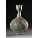 A KASHAN TURQUOISE GLAZED MOULDED BOTTLE VASE, PERSIA, 12TH CENTURY