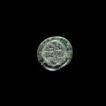 A FATIMID GLASS WEIGHT OF QUATER DIRHAM, AL-HAKIM BI-AMR ALLAH (386AH-411AH/ 996AD-1021AD)