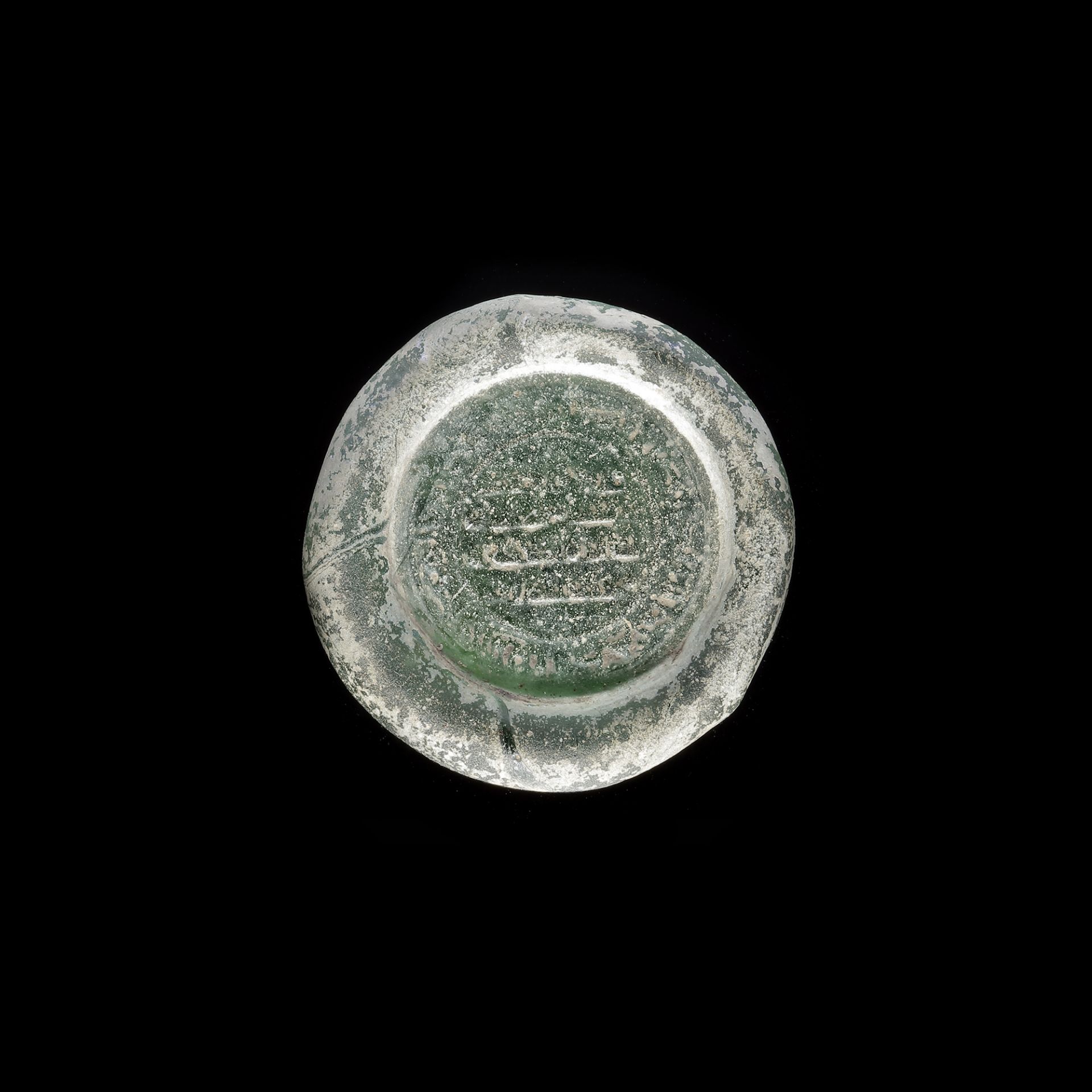 A FATIMID GLASS WEIGHT OF DOUBLE DINAR, EGYPT AL-MUSTANSIR BI-ALLAH (AH 427-487 / 1036-1094 AD)