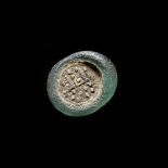 A FATIMID GLASS WEIGHT OF HALF DIRHAM, EGYPT AL-ZAHIR ( 412-427 AH/ 1021-1036 AD)