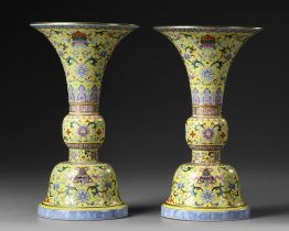 A PAIR OF CHINESE YELLOW-GROUND FAMILLE ROSE GU VASES, QING DYNASTY (1644-1911)