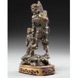 A CHINESE BRONZE FIGURE OF LOHAN WITH A BOY, 19TH CENTURY