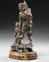 A CHINESE BRONZE FIGURE OF LOHAN WITH A BOY, 19TH CENTURY