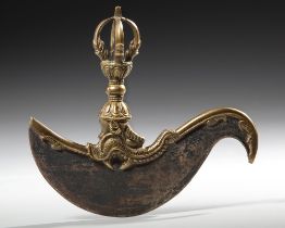 A GILT TIBETAN BRONZE KARTIKA OR VAJRA KNIFE, CIRCA 1900