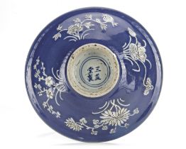 A CHINESE BLUE-GROUND SLIP DECORATED BOWL, 17TH CENTURY