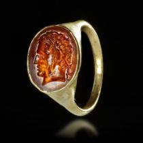 A GOLD RING WITH A CARNELIAN INTAGLIO WITH THE PORTRAIT OF A HELLENISTIC RULER, 2ND/3RD CENTURY BC