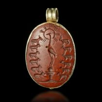 A ROMAN GNOSTIC PENDANT IN GOLD WITH A RED JASPER INTAGLIO, 2ND/3RD CENTURY AD