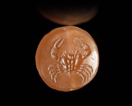 AN EASTERN GREEK SEAL IN ORANGE CARNELIAN WITH A CRAB, 5TH CENTURY BC