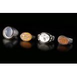 FOUR AGATE SILVER RINGS