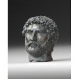 A MINIATURE BRONZE HEAD OF THE EMPEROR HADRIAN, 117-138 AD 2ND CENTURY AD